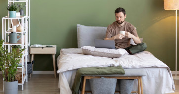 Smart furniture choices for a small bedroom with a comfortable bed, practical nightstand, and space-saving storage.