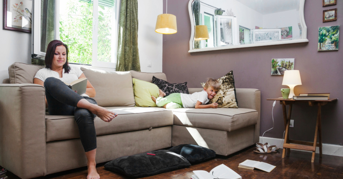 Cozy, well-styled home interior featuring a budget-friendly living room and bedroom furniture set with warm tones, soft textures, and personal touches.