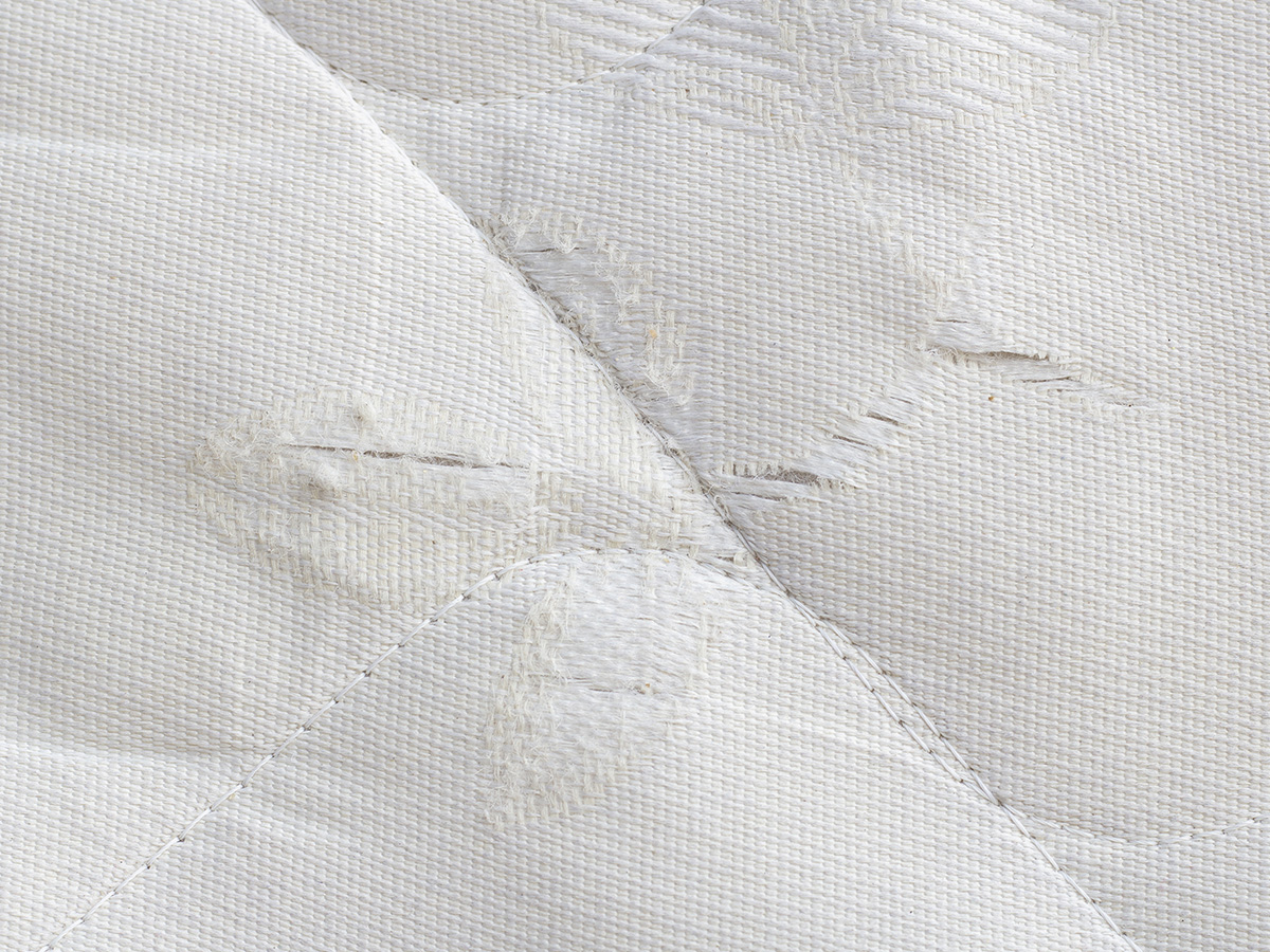image of a torn mattress